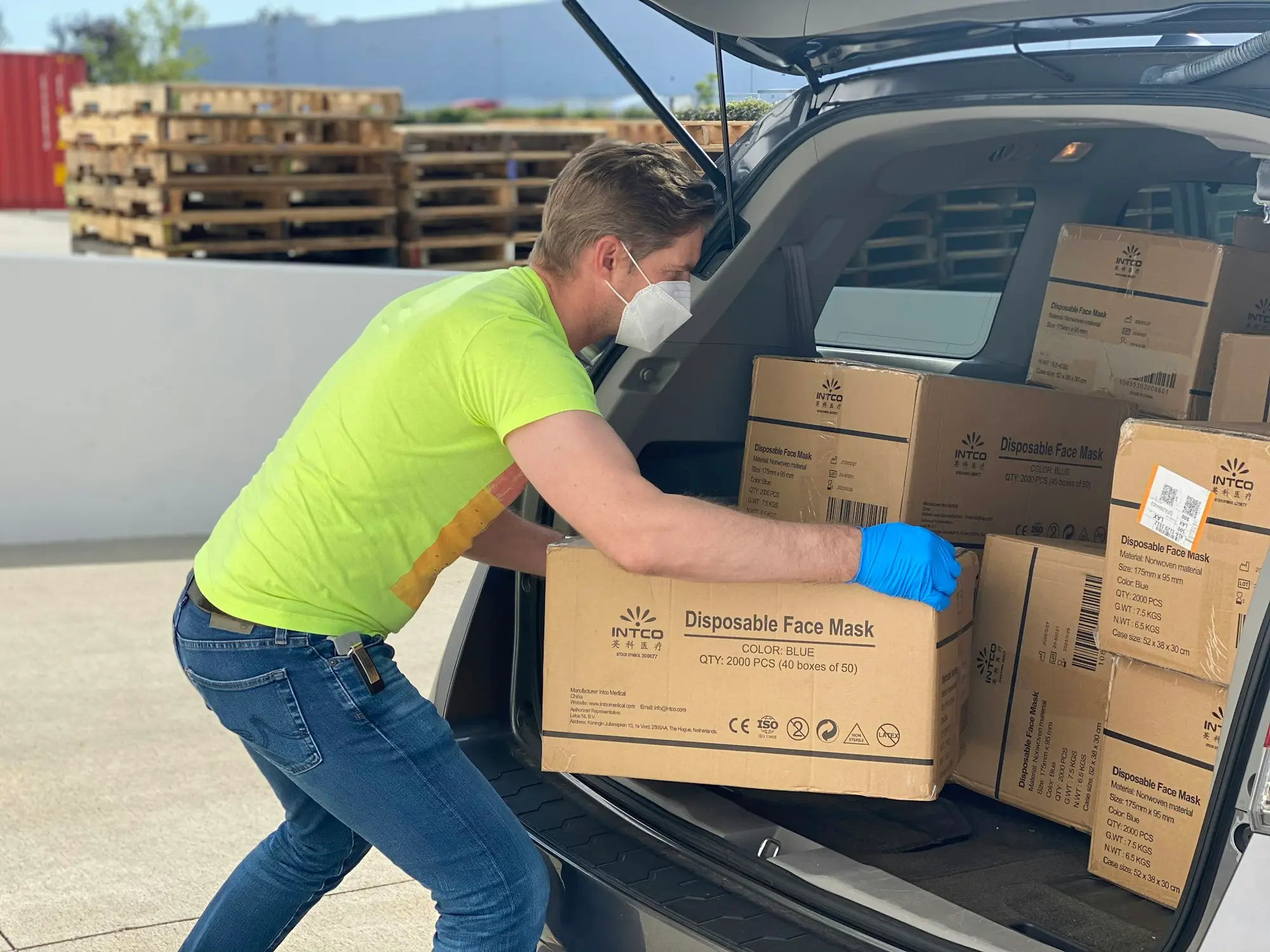 Delivery van being loaded with parcels at a loading dock