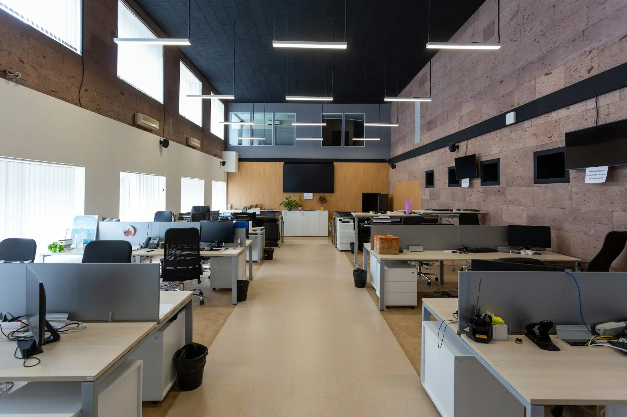 Open-plan office with rows of desks and computers where payroll and super payments are processed